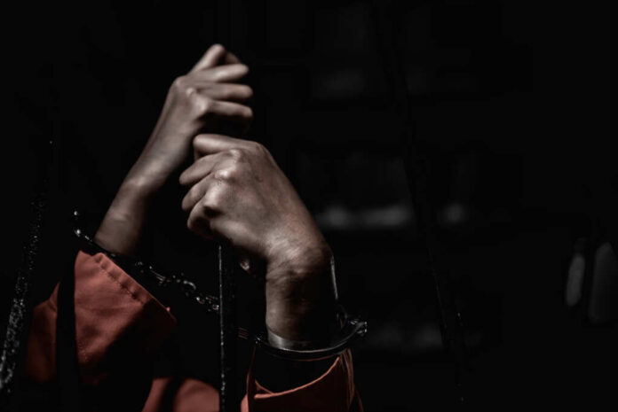 Hands,Of,Women,Desperate,To,Catch,The,Iron,Prison,prisoner,Concept,thailand