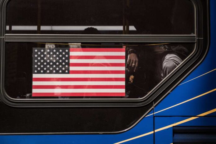 Migrants,Resting,Inside,A,New,York,City,Public,Transportation,Bus