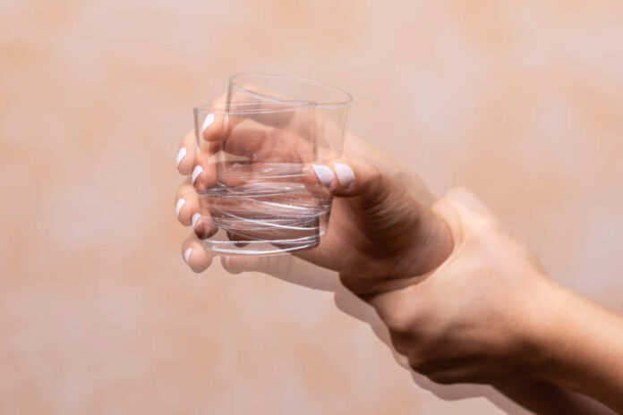 Closeup,View,On,The,Shaking,Hand,Of,A,Person,Holding