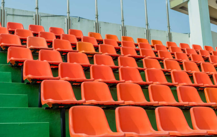 Rows,Of,Empty,Orange,Stadium,Seats,At,Sports,Complex,During