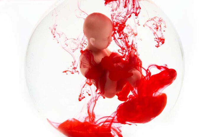 Abortion,Concept.,Baby,Doll,In,The,Red,Blood,Looks,Like