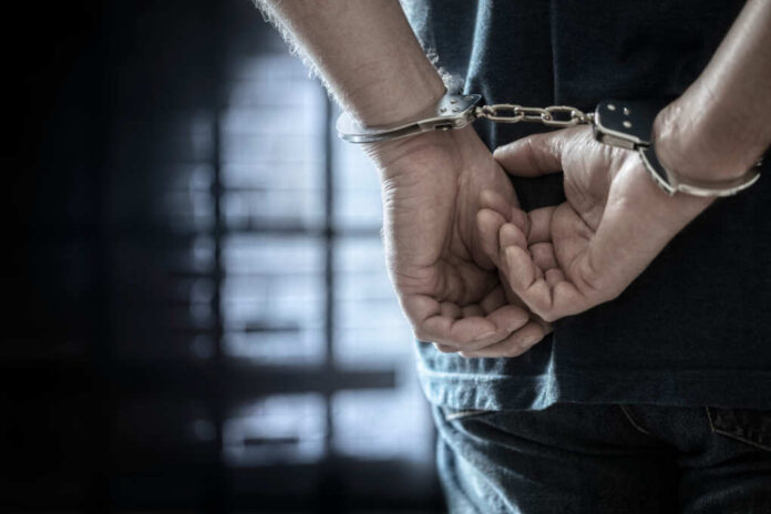 Arrested,Man,In,Handcuffs,With,Handcuffed,Hands,Behind,Back,In
