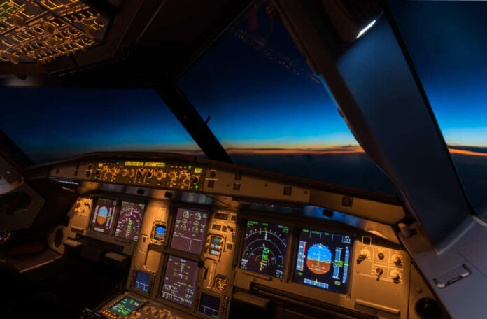 Jet,Aircraft,Cockpit,At,Twilight,Time.
