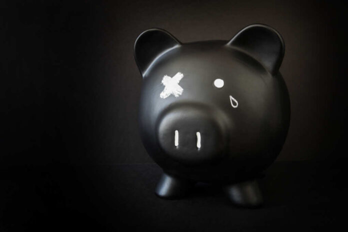 Black,Piggy,Bank,With,A,Tear,And,X'd,Out,Eye,
