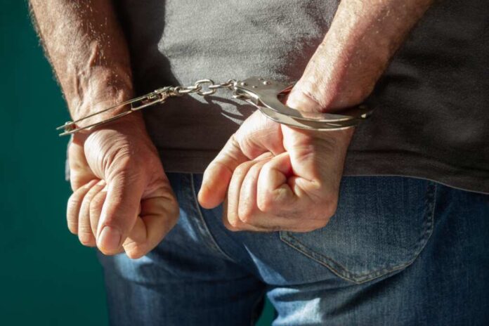 Detained,Man,With,Hands,Behind,His,Back.,Cutaway,View,Of