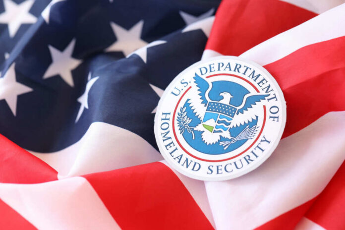 shutterstock2452226157jpg U.S. Department of Homeland Security emblem on an American flag