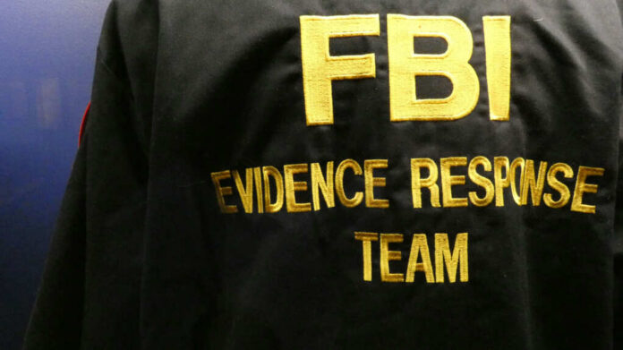 shutterstock_2055605552.jpg Close-up of an FBI Evidence Response Team jacket with gold lettering