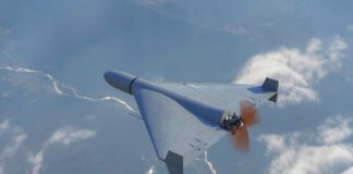 A drone flying high above the clouds with a visible propeller