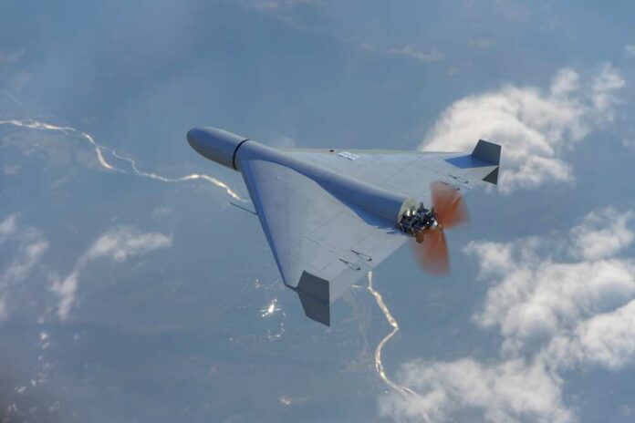 A drone flying high above the clouds with a visible propeller