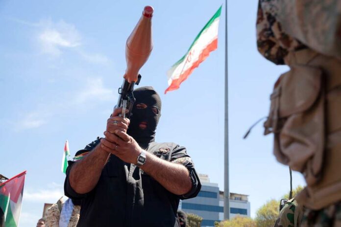 Masked individual holding a weapon during a military demonstration