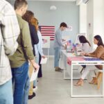 People waiting in line at a polling station to cast their votes