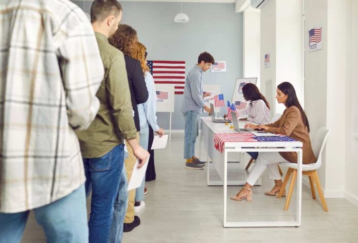 People waiting in line at a polling station to cast their votes