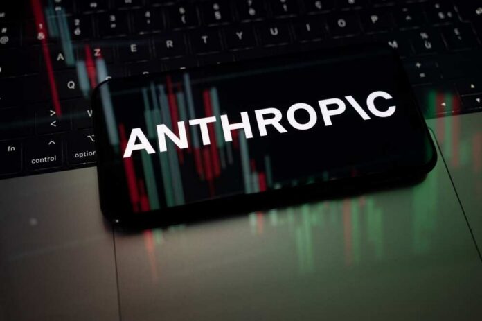 Mobile phone displaying the word 'ANTHROPIC' over a background of financial graphs