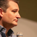 Senator Warns US: Terror Threat Skyrockets Profile view of a politician speaking into a microphone