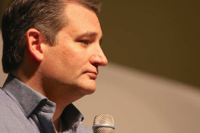 shutterstock_358800035.jpg Profile view of a politician speaking into a microphone