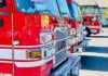 Close-up of red fire trucks parked in a row