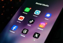 Massachusetts Bill Sparks Surveillance Fears Close-up of a smartphone screen displaying various social media app icons