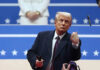Trump “Bored” with Iran War—What’s Next? A man in formal attire gesturing during a political event