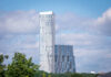 Two modern high-rise buildings against a cloudy sky