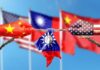Hands painted with flags of China and the USA pulling a torn Taiwan flag