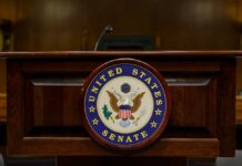 GOP Senators Spark Firestorm With Iran Vote Podium with the United States Senate seal in a formal setting