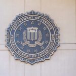 FBI seal mounted on a wall, representing the Federal Bureau of Investigation