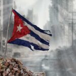 Is US’s Plan Pushing Cuba to Collapse? Tattered Cuban flag waving over a pile of rubble in a devastated urban landscape