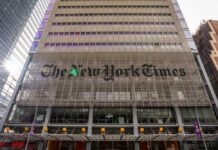 Facade of The New York Times building with large signage