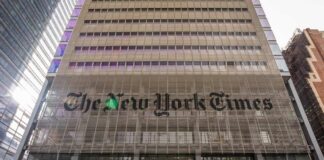 Facade of The New York Times building with large signage