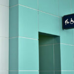 Restroom entrance with accessibility and family icons