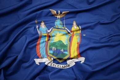 New York State flag with coat of arms on blue field