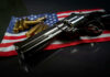 9–0 STUNNER: SCOTUS Slaps Biden Gun Ban A revolver and bullets placed on an American flag