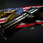 9–0 STUNNER: SCOTUS Slaps Biden Gun Ban A revolver and bullets placed on an American flag