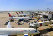 Fuel Shock Guts Airline Profits View of multiple Delta Airlines planes parked at an airport terminal with ground crew and vehicles