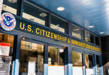 Legal Immigration Just Got Pricier Entrance of the U.S. Citizenship and Immigration Services office with signage