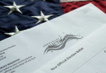 An official election ballot placed on an American flag background