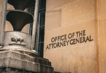 Office of the Attorney General building facade with metal sculpture