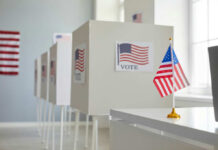 Why Americans Doubt Election Results Voting booths with American flags in a polling station