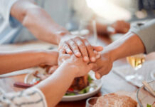 New Bill Lets Outsiders Call The Shots? Several hands stacked together over a plate of food, symbolizing unity and support