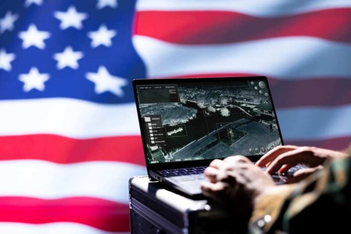 Usa,Cia,Agent,Combating,Organized,Crime,And,Terrorism,Using,Surveillance Laptop with surveillance software against a blurred American flag