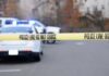 Unsecured Gun Kills Georgia Toddler Police tape cordons off a street with patrol cars in the background