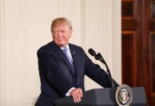 Third Term Tease Stuns D.C. man at podium with presidential seal
