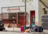 NYC U-Turn: Camps Cleared In 7 Days Sidewalk scene outside a housing clinic with people and belongings