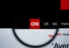 CNN’s Goalposts Drama Explodes CNN logo on a website header viewed through a magnifying glass