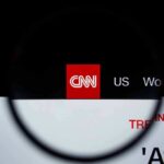 CNN’s Goalposts Drama Explodes CNN logo on a website header viewed through a magnifying glass