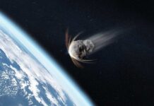 An asteroid approaching Earth in space