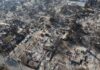 Night Of Fire Devastates Kyiv Homes Aerial view of a neighborhood devastated by wildfire, showing burned structures and debris