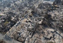 Night Of Fire Devastates Kyiv Homes Aerial view of a neighborhood devastated by wildfire, showing burned structures and debris