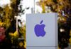 Apple Drops Bomb on OpenAI Purple Apple logo on a white sign in an outdoor setting