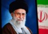 Successor Missing From Historic Funeral Portrait of a political leader with a black turban and glasses